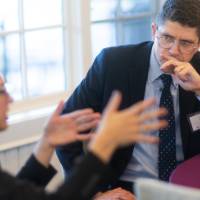 faculty in deep conversation